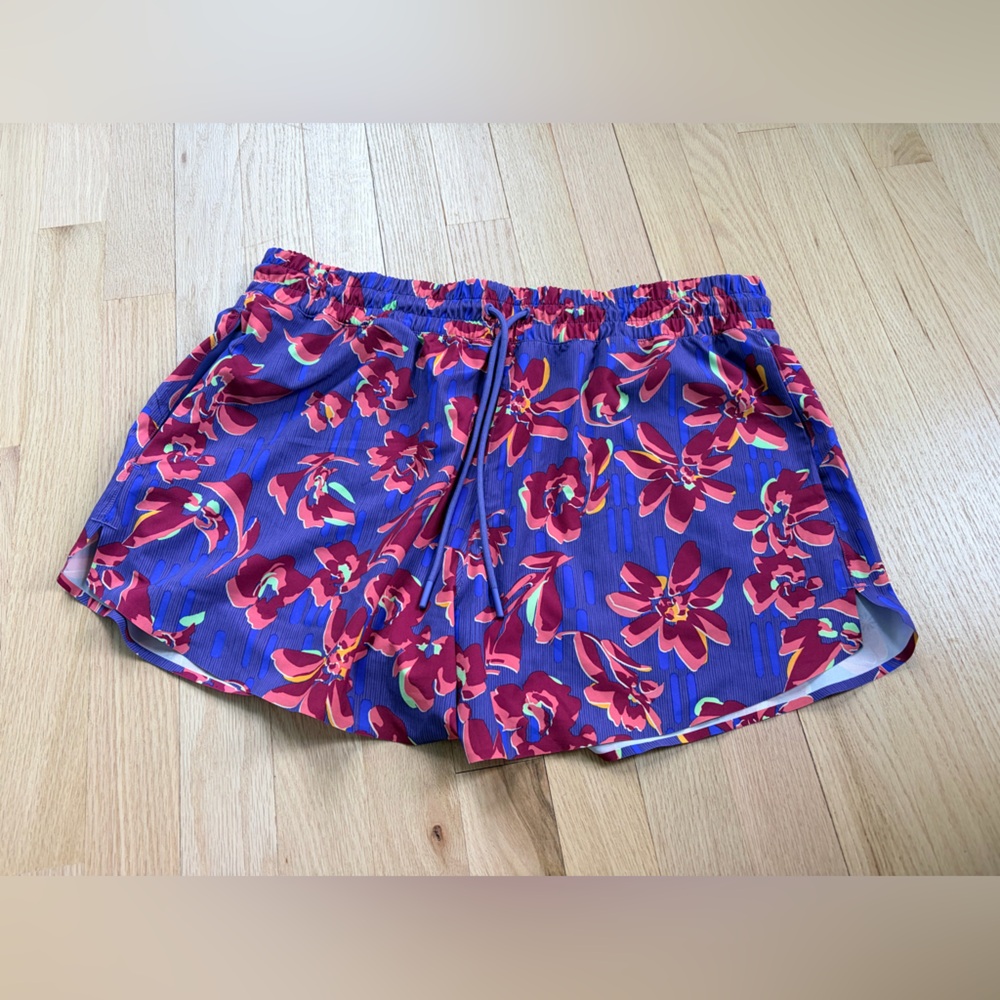 My loss your gain: Athleta Purple Floral Athletic Shorts size large EUC